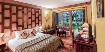 a bedroom with a bed and a desk