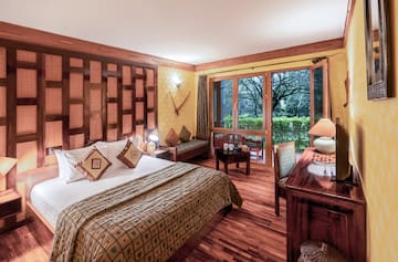 a bedroom with a bed and a desk