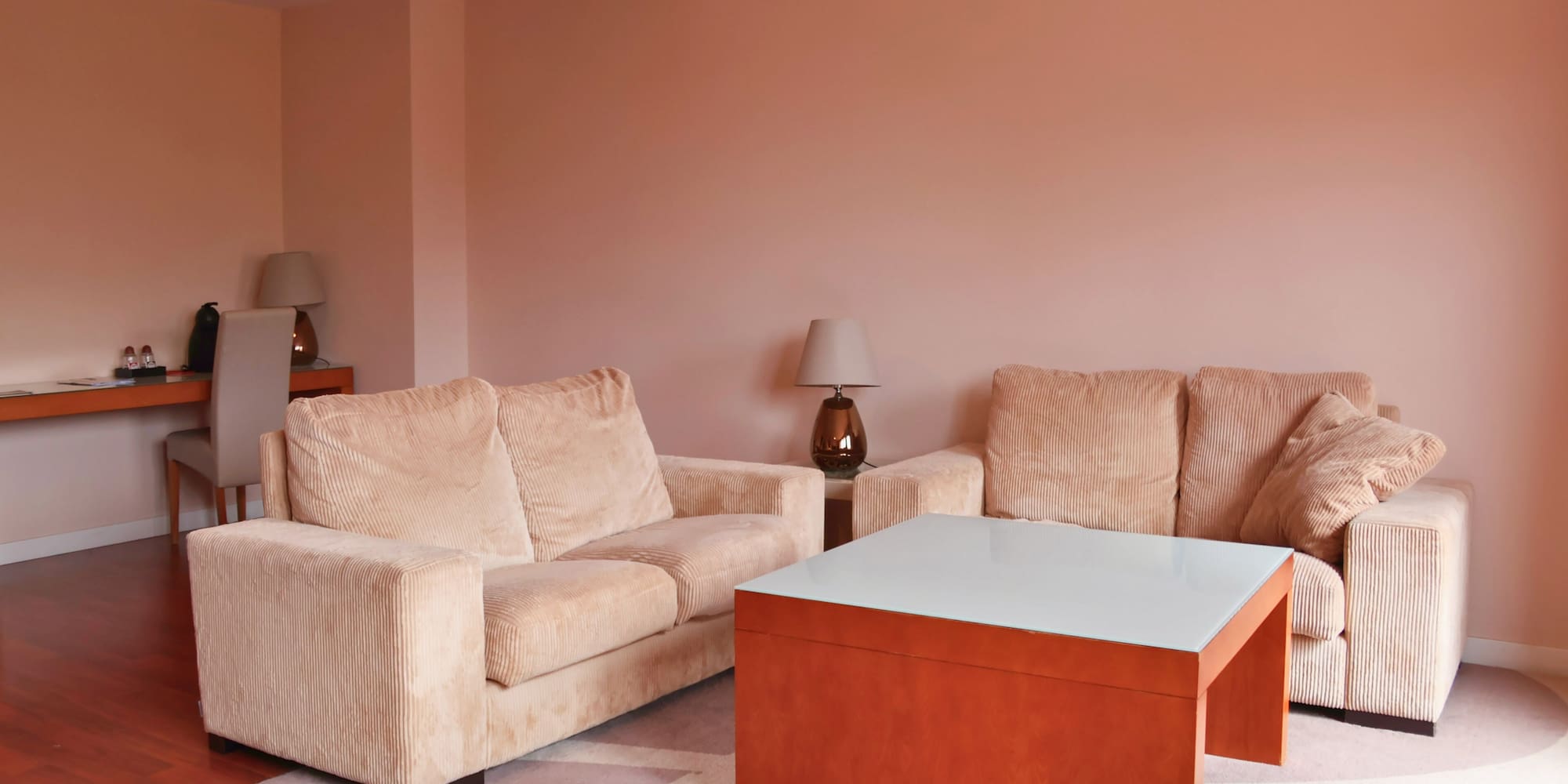 a living room with couches and a coffee table