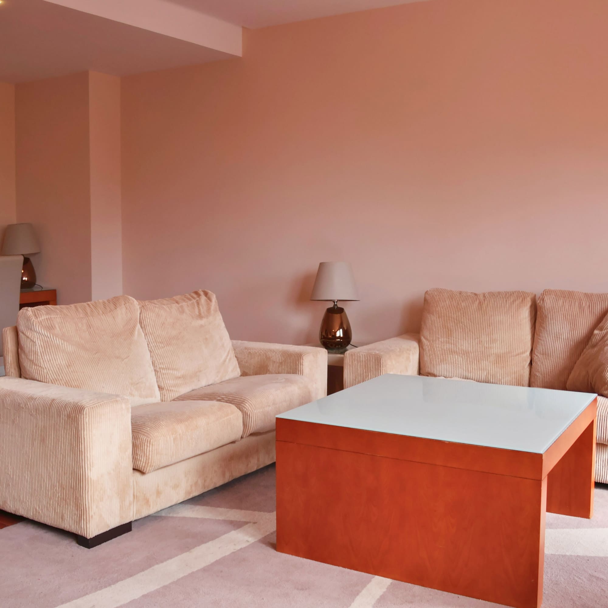 a living room with couches and a coffee table