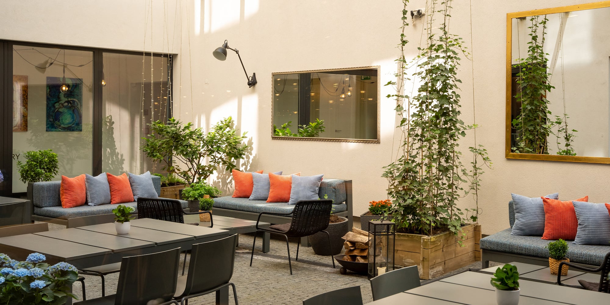 a patio area with tables and chairs