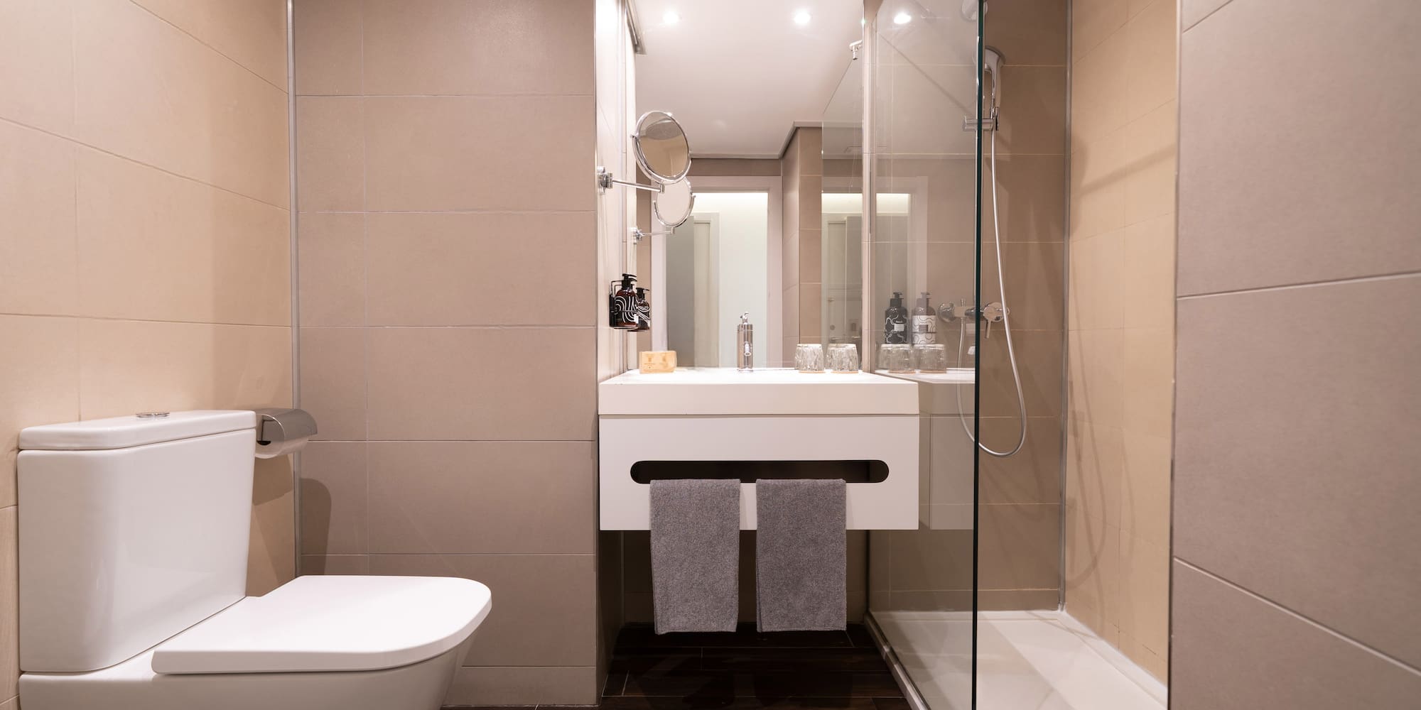 a bathroom with a glass shower door