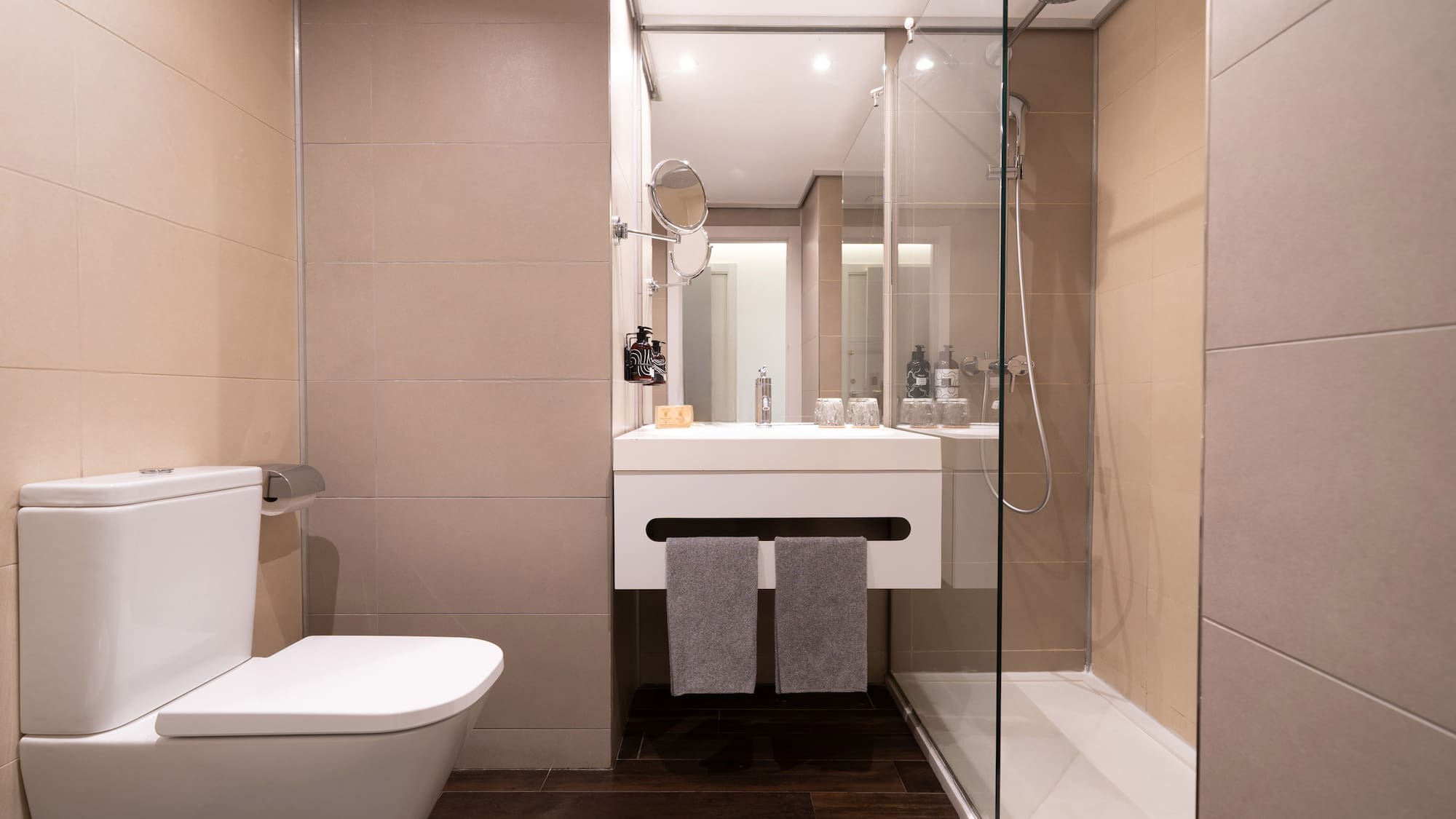 a bathroom with a glass shower door