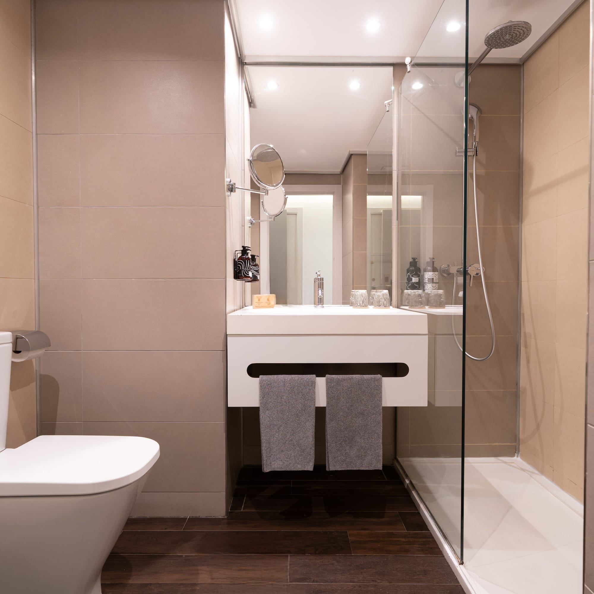 a bathroom with a glass shower door