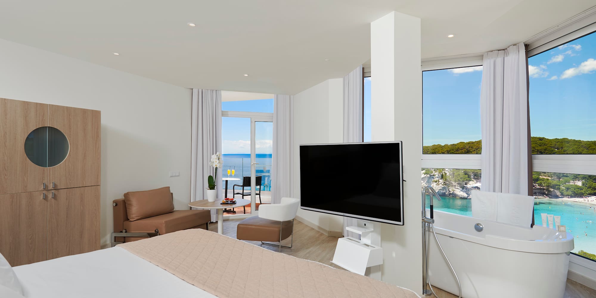 a room with a large television and a large window