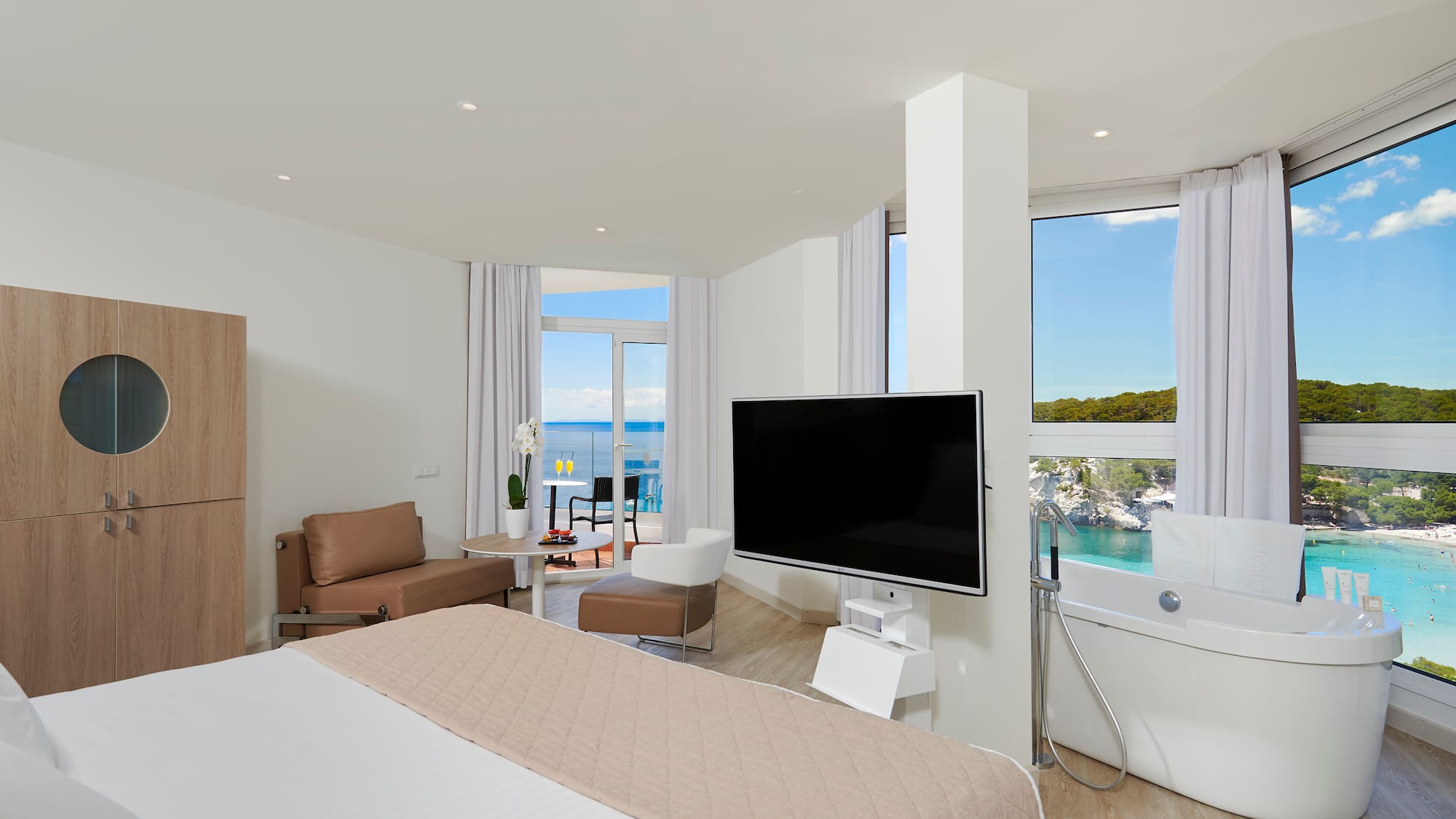 a room with a large television and a large window