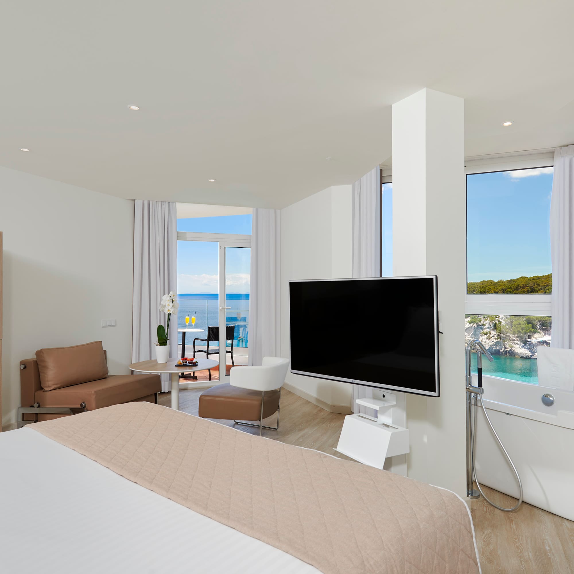 a room with a large television and a large window