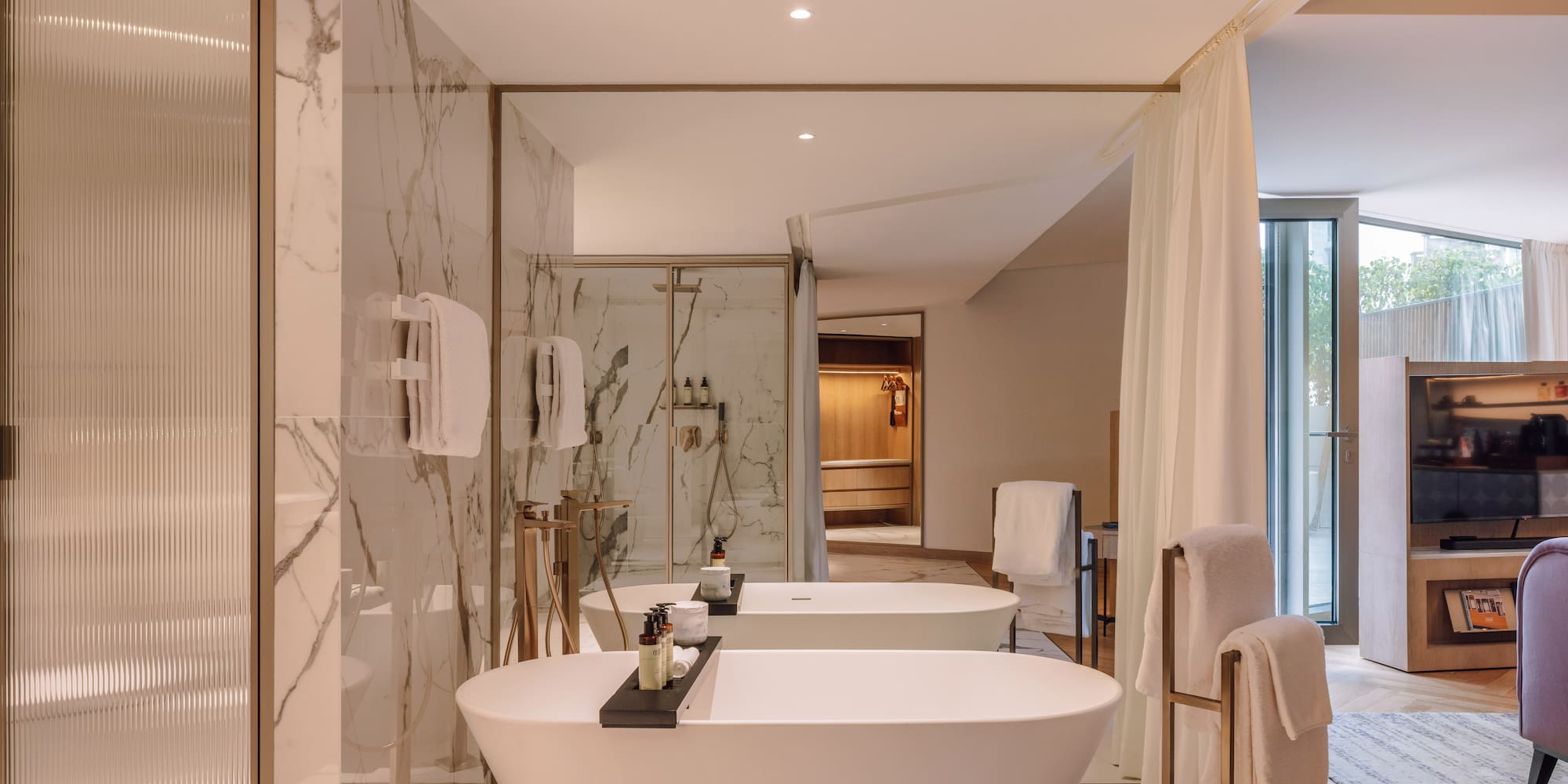 a bathroom with a tub and shower