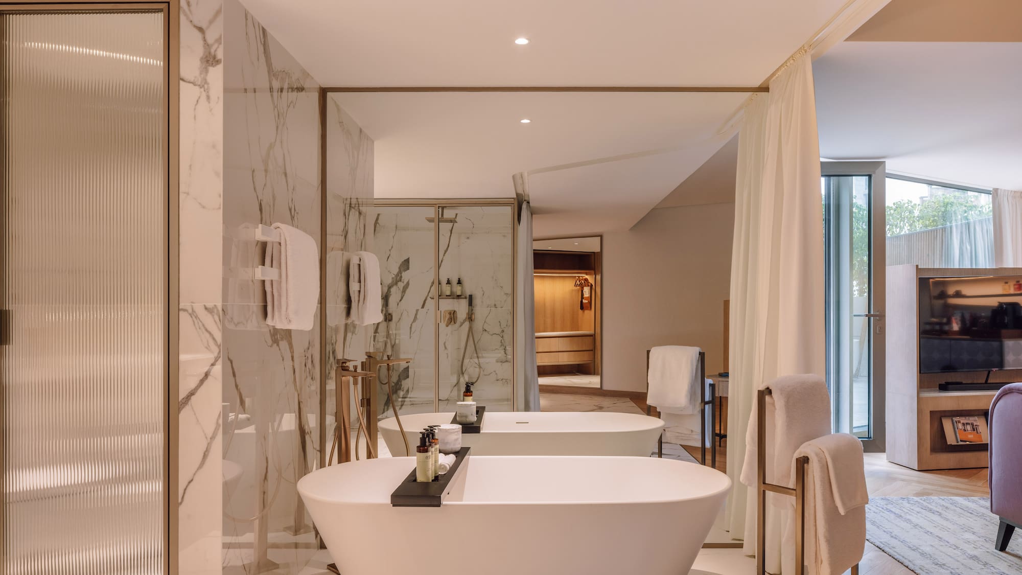 a bathroom with a tub and shower