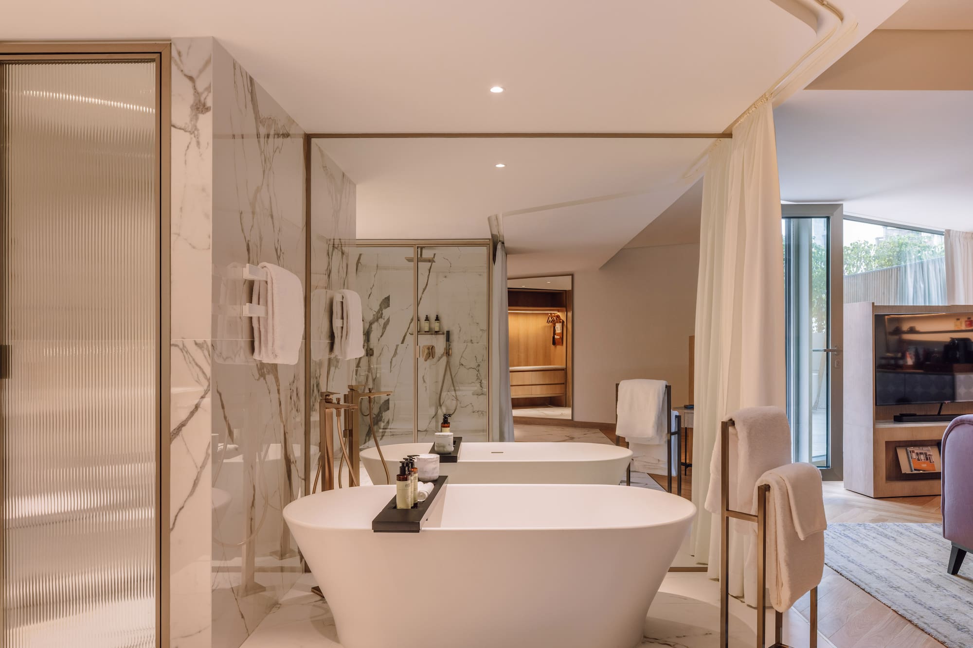 a bathroom with a tub and shower