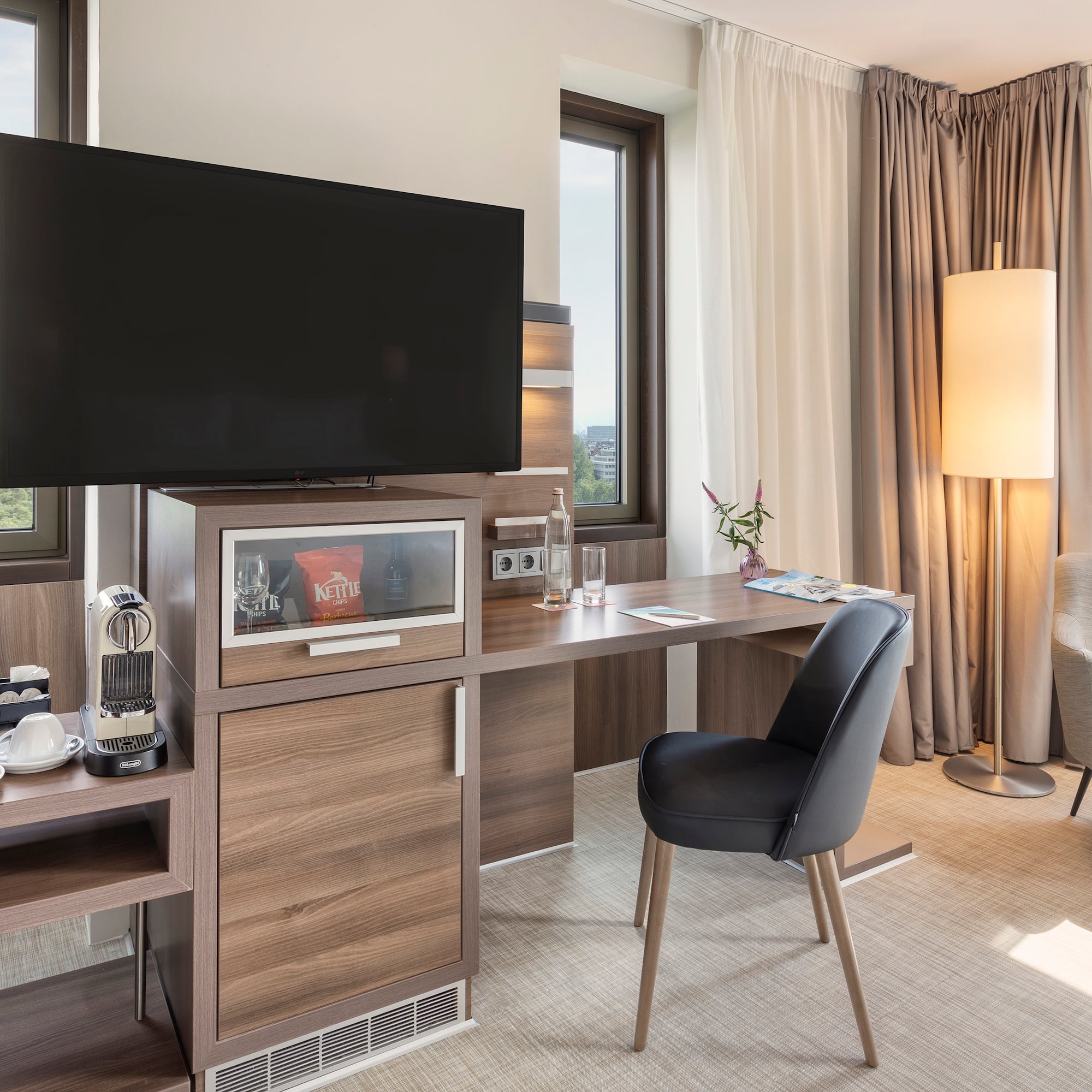 a room with a tv and a table