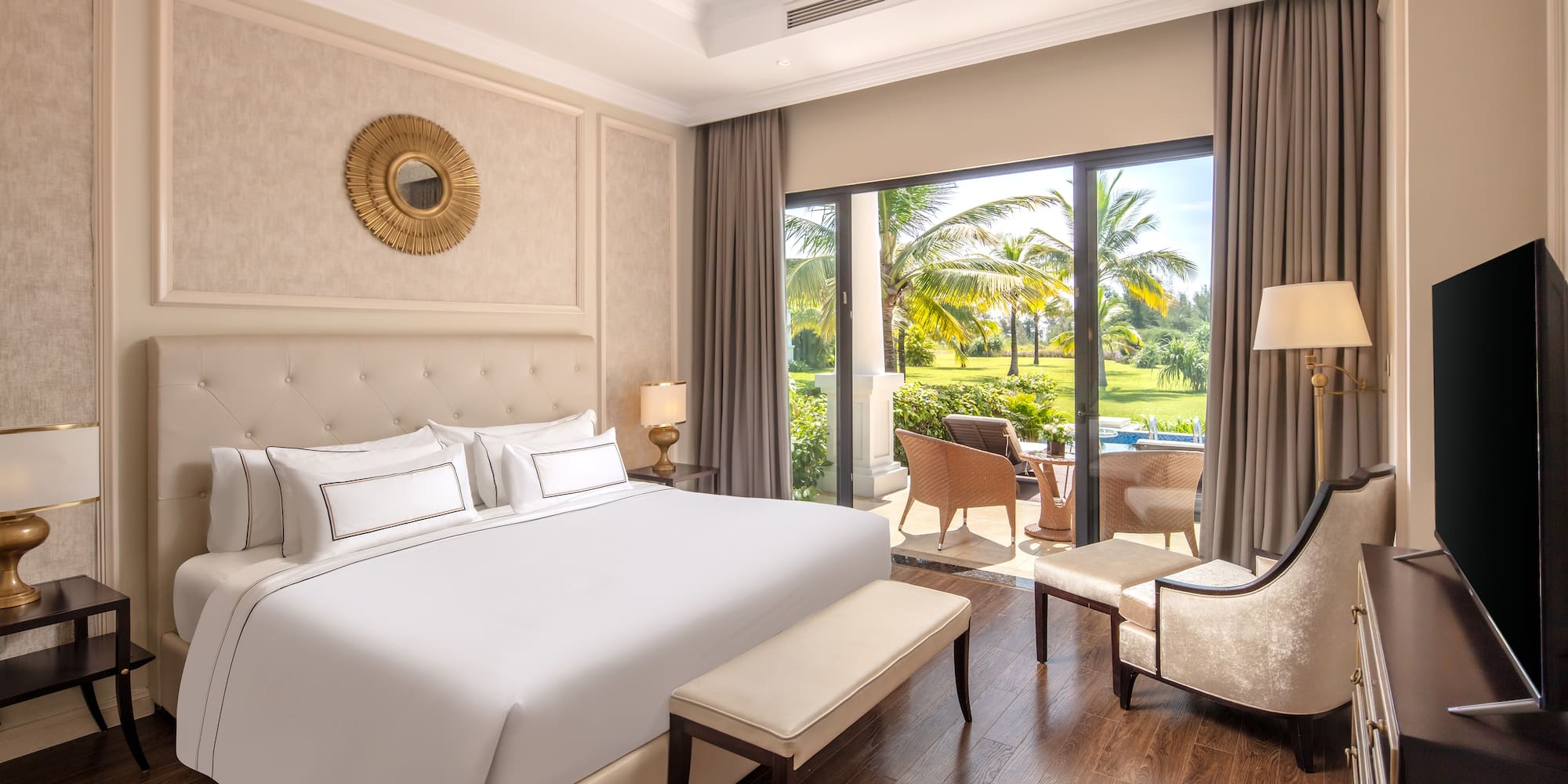 a bedroom with a large bed and a chair