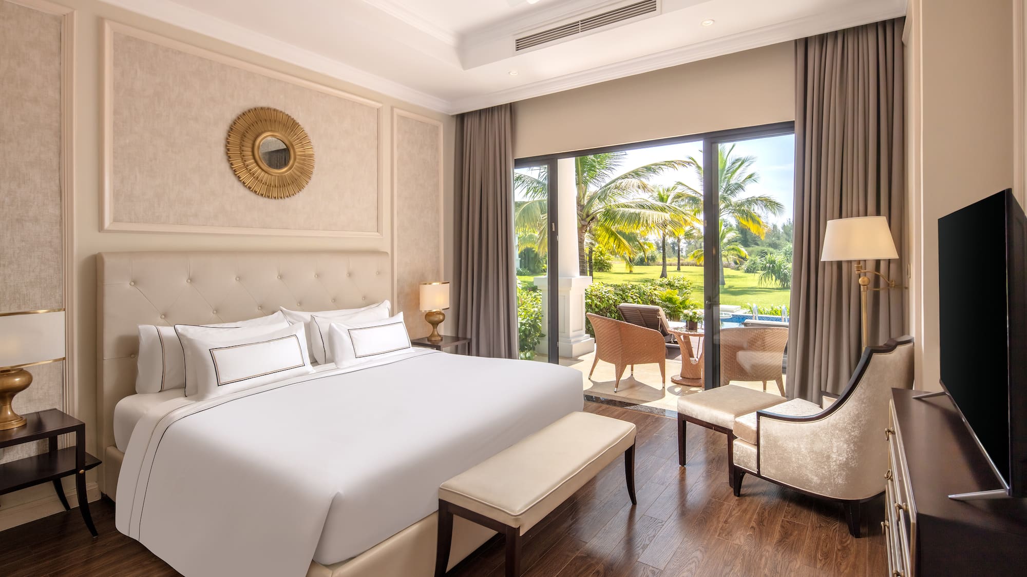 a bedroom with a large bed and a chair