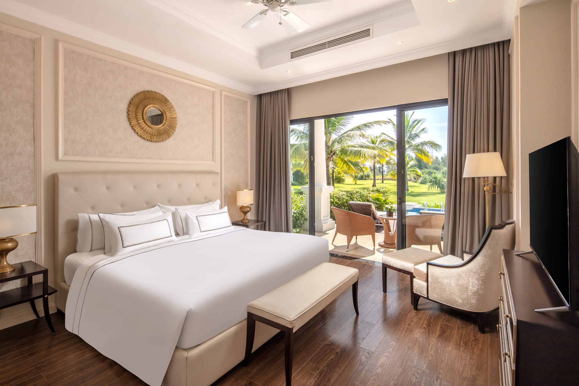 a bedroom with a large bed and a chair