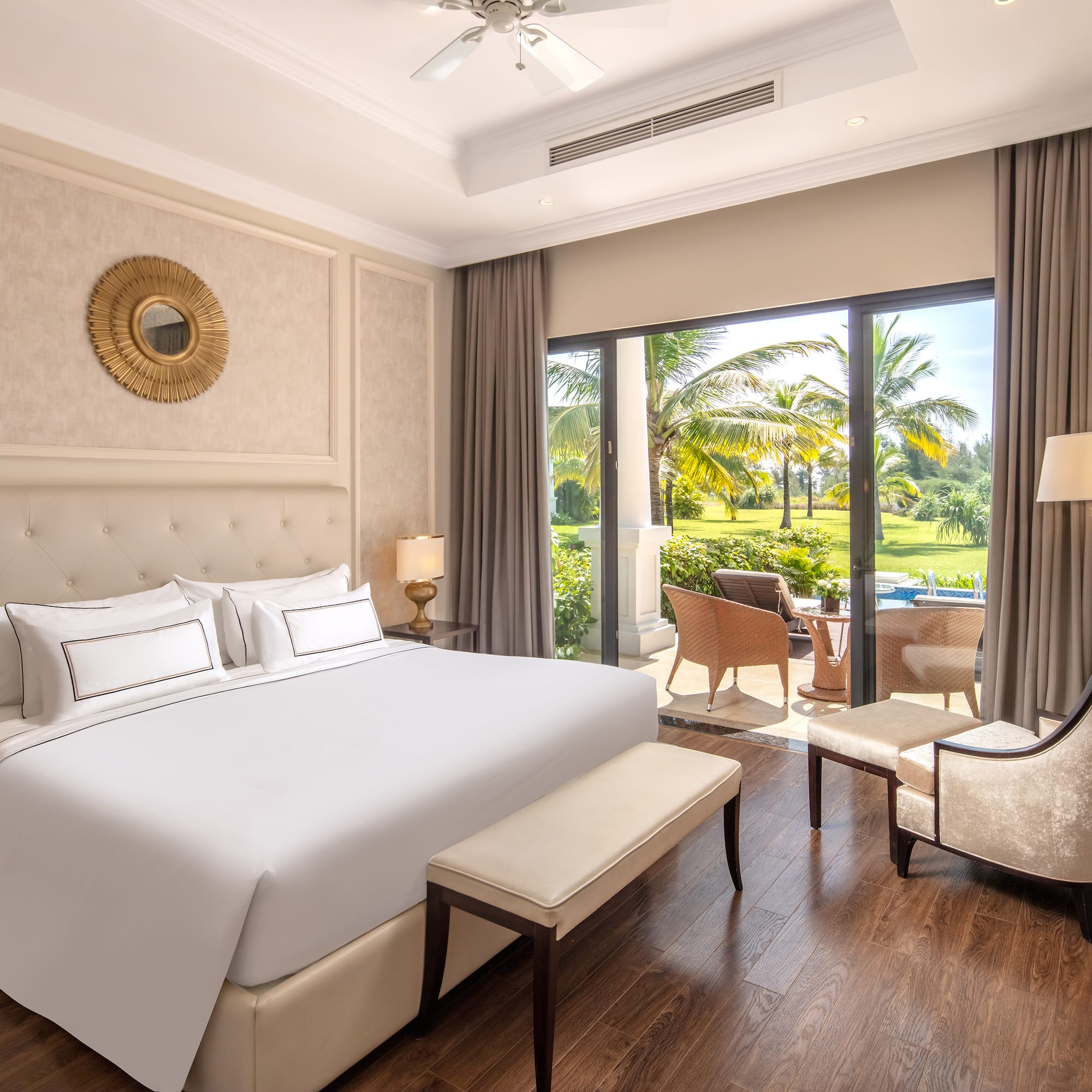 a bedroom with a large bed and a chair