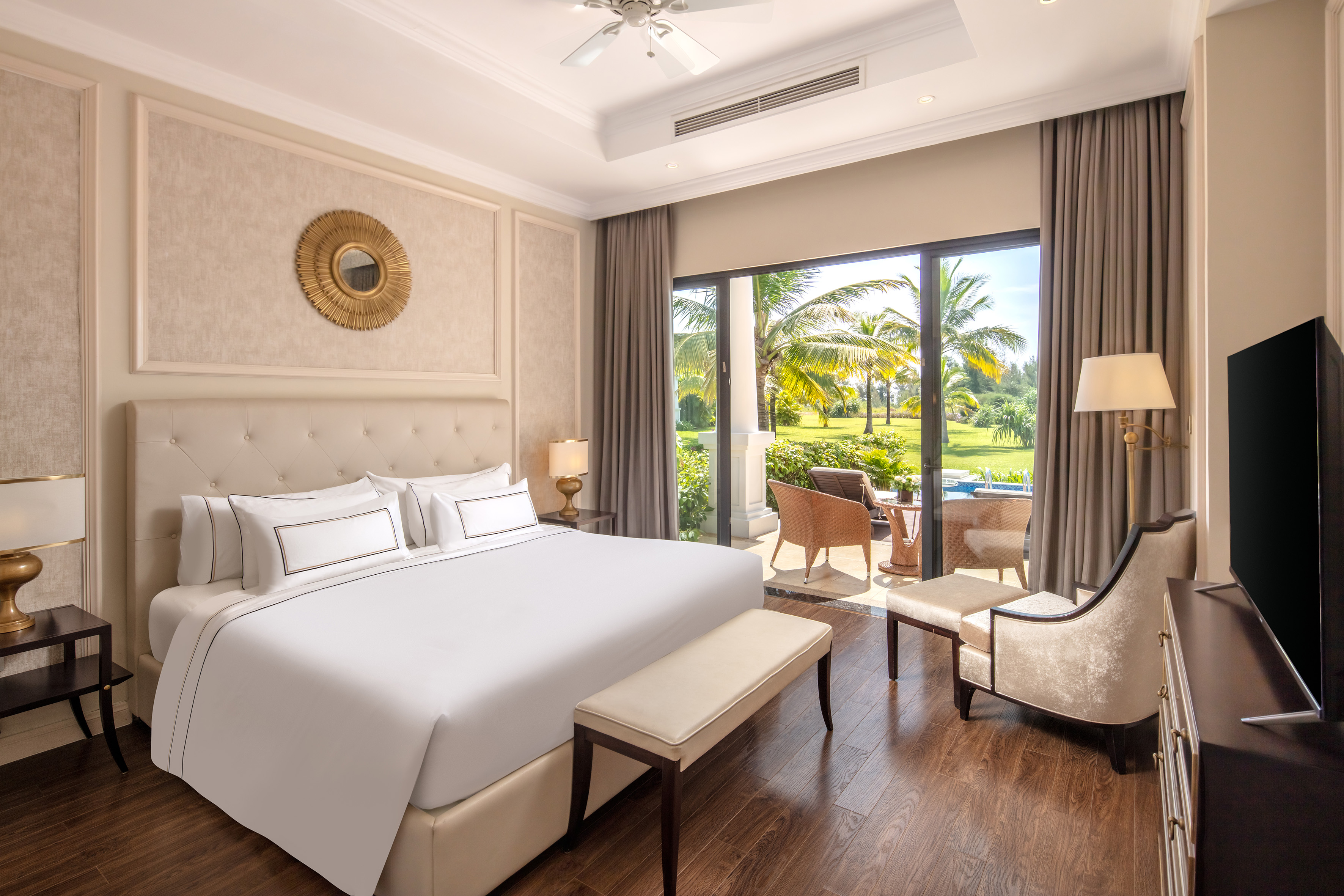 a bedroom with a large bed and a chair
