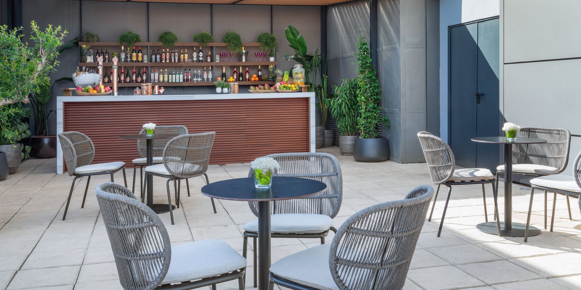 a patio with chairs and tables