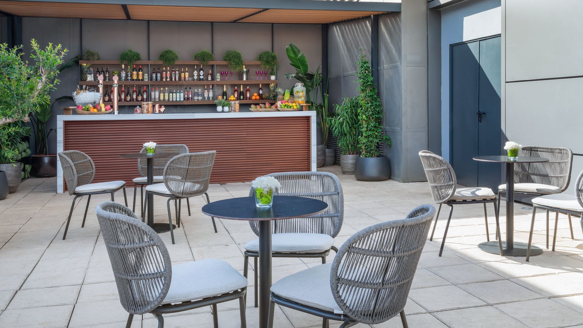 a patio with chairs and tables
