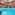 Indoor spa pool with hydrotherapy, waterfalls, and a glass dome ceiling.