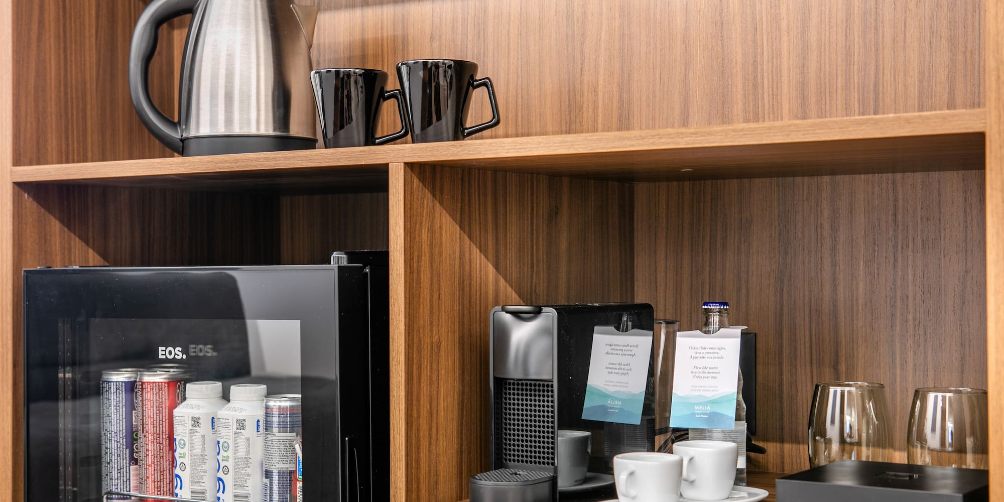 a shelf with coffee cups and other items on it