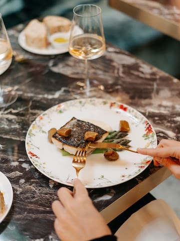 a person eating food on a plate