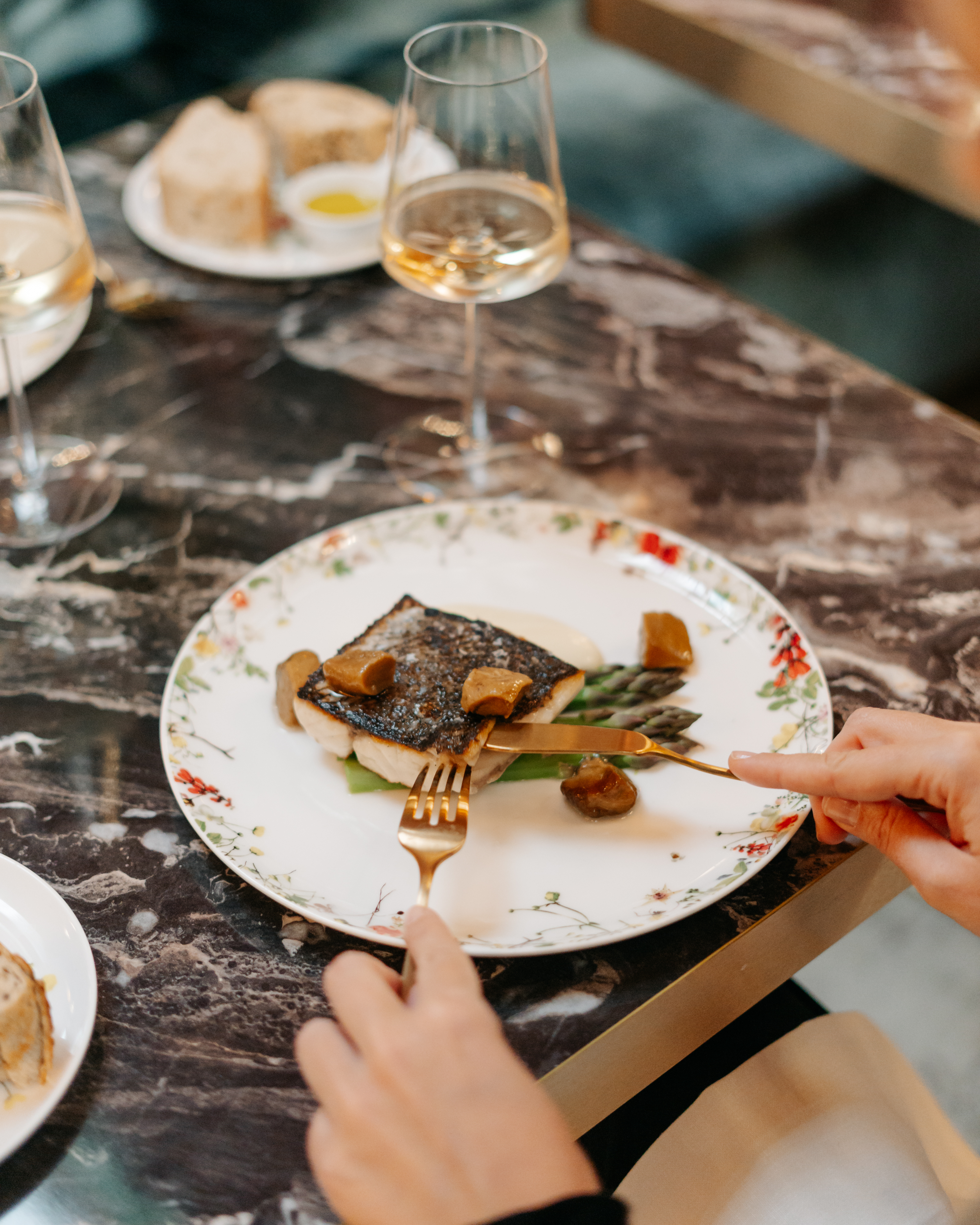 a person eating food on a plate