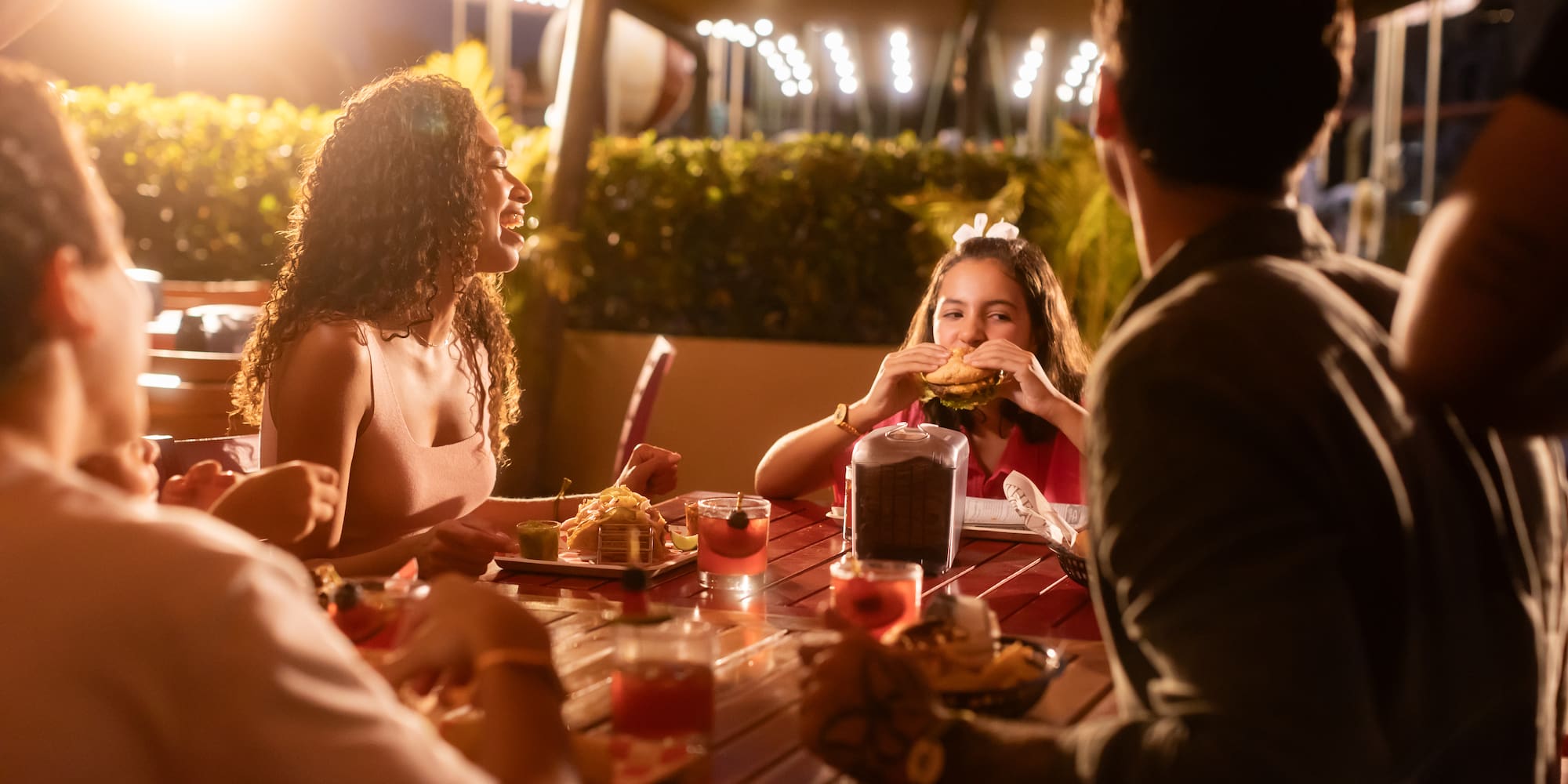 a group of people eating at a table