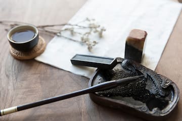 a pen and ink pen on a table