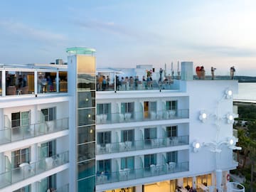 a group of people on a rooftop of a building