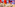 Modern bowling alley with multiple lanes, seating area, and vibrant decor.