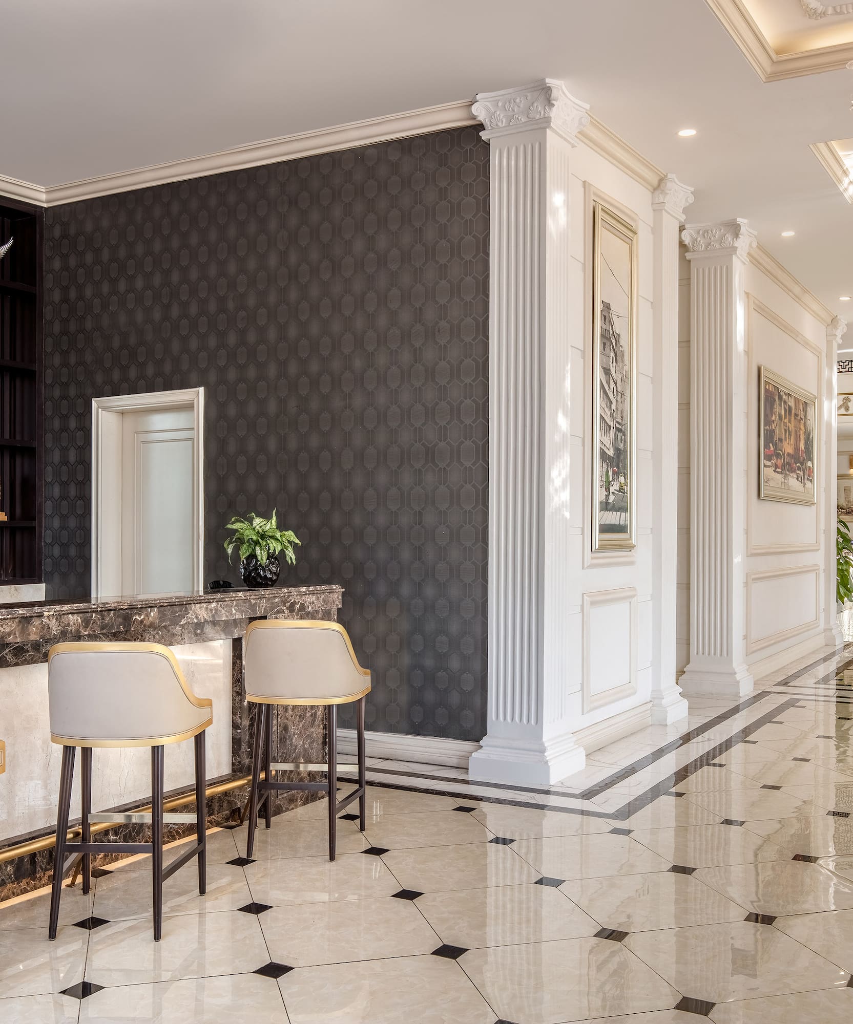 a lobby with a marble floor and chairs