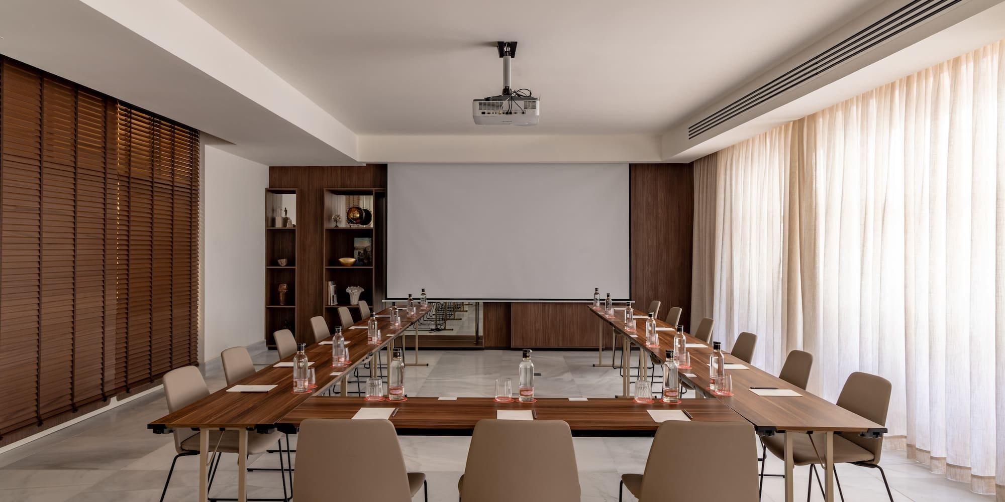 a room with a large table and chairs