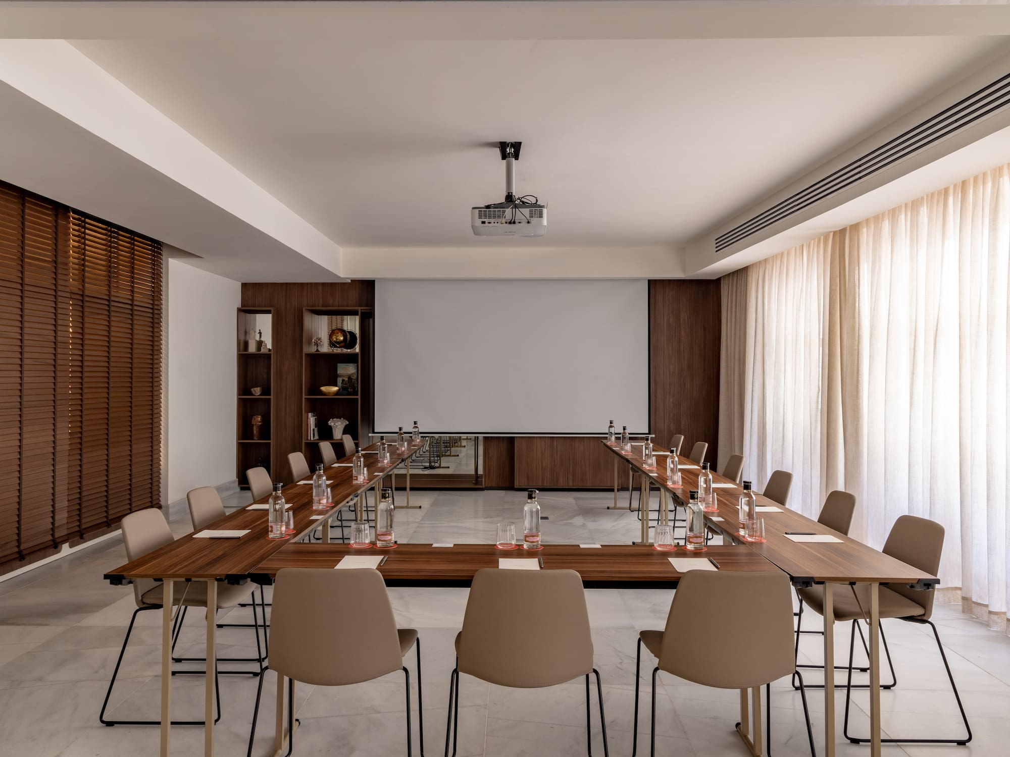 a room with a large table and chairs