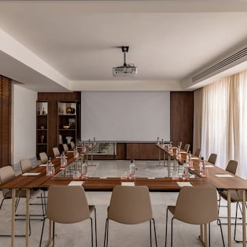 a room with a large table and chairs