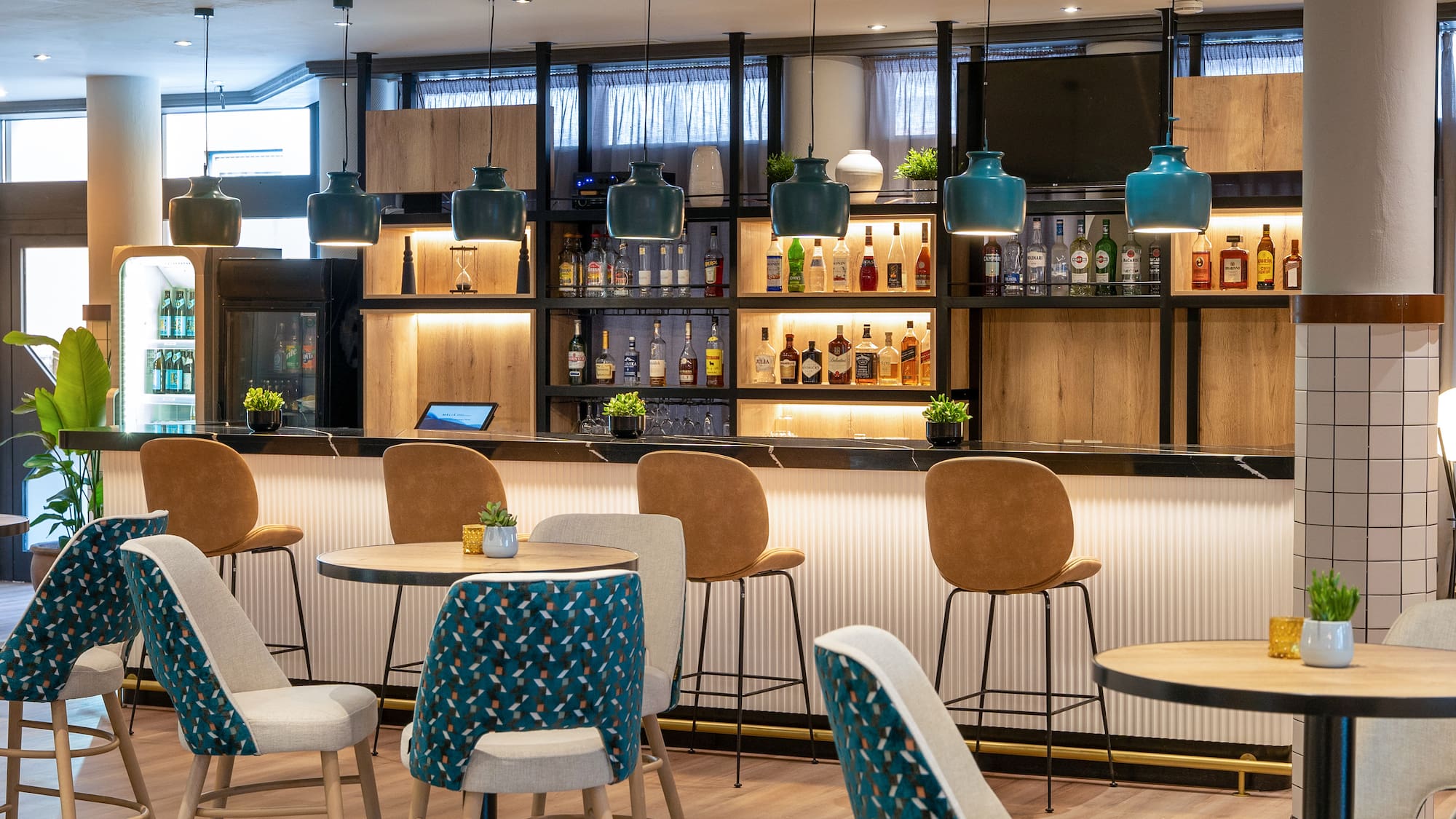 a bar with chairs and tables