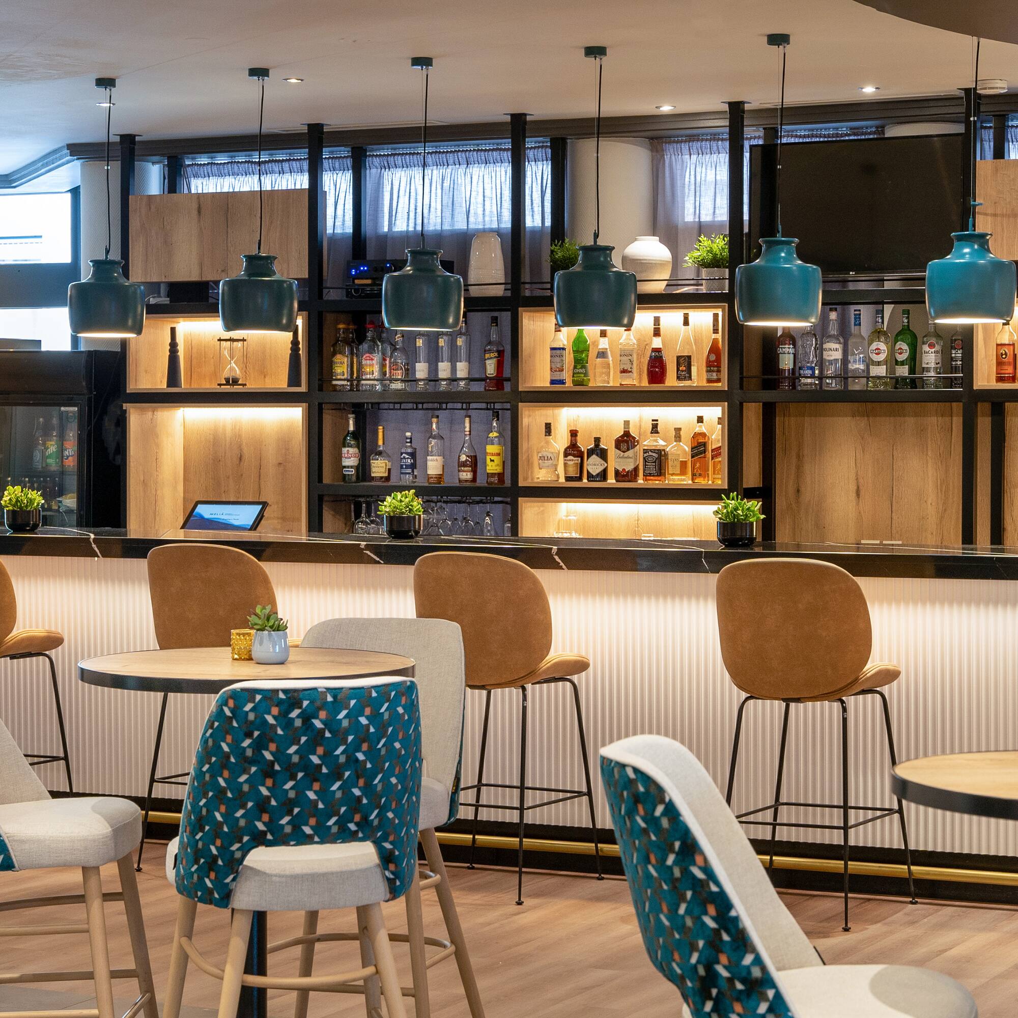 a bar with chairs and tables