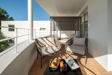 a patio with chairs and a table