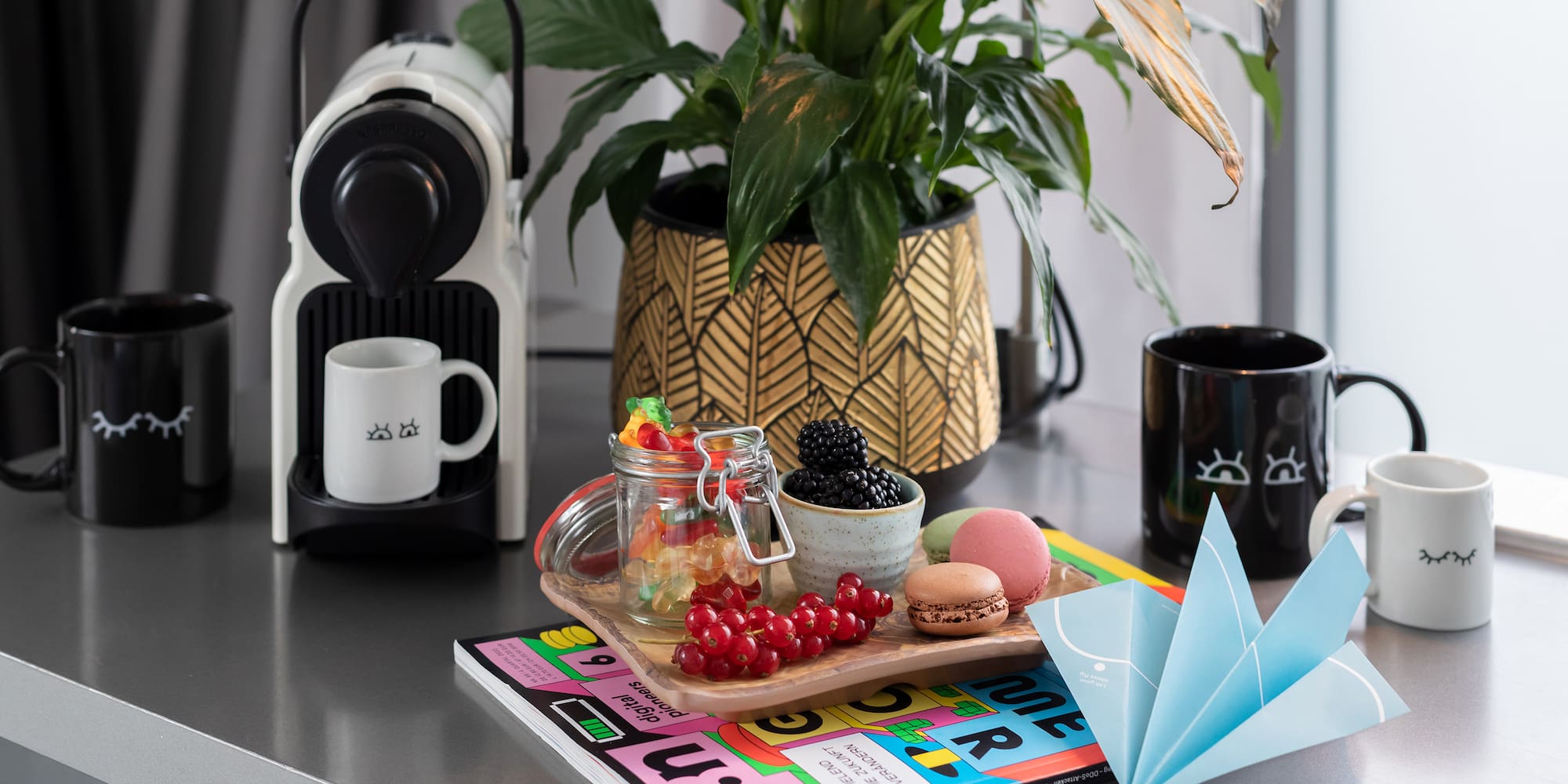 a table with a book and fruit on it