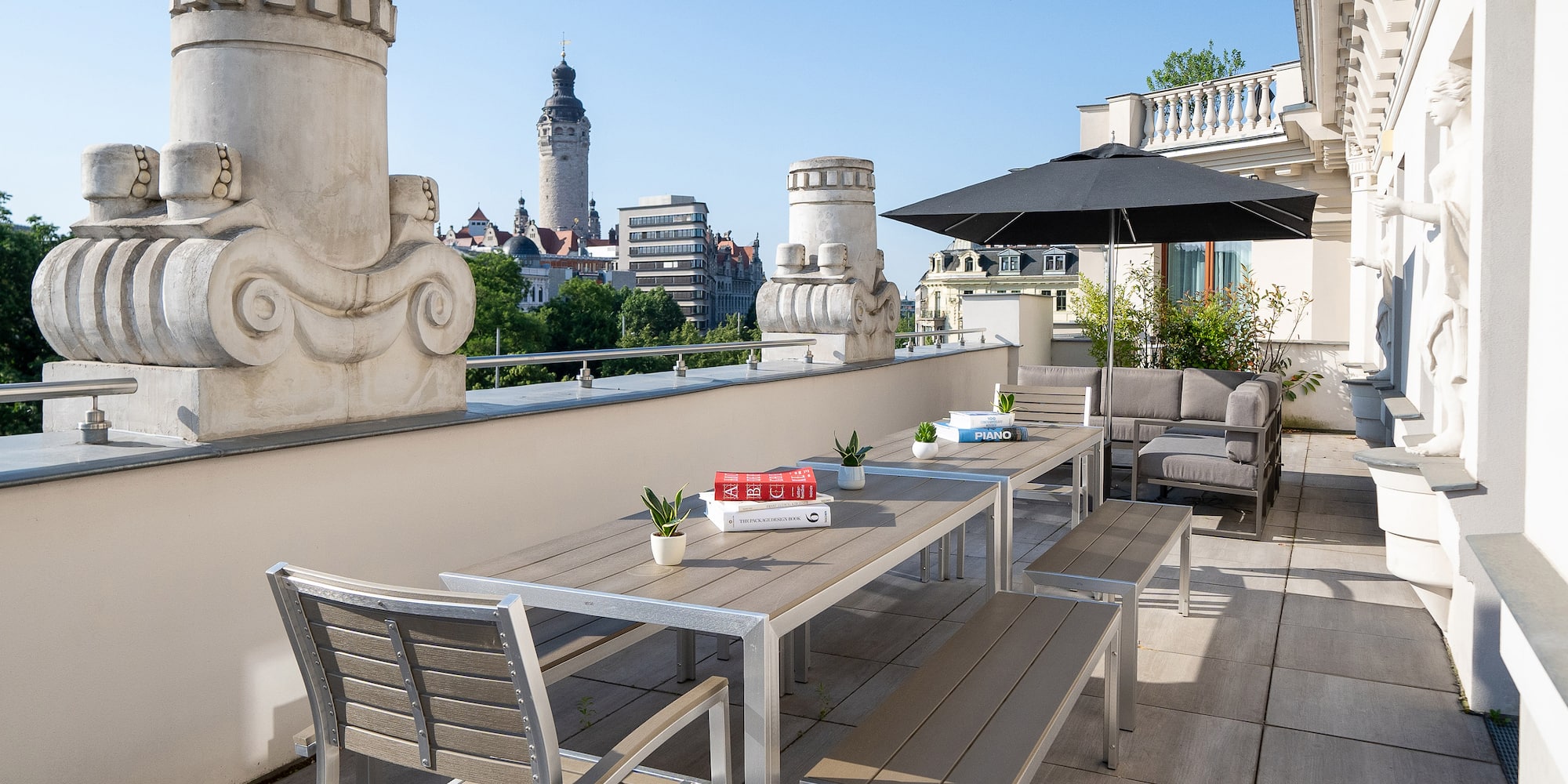 a patio with a table and chairs on a balcony