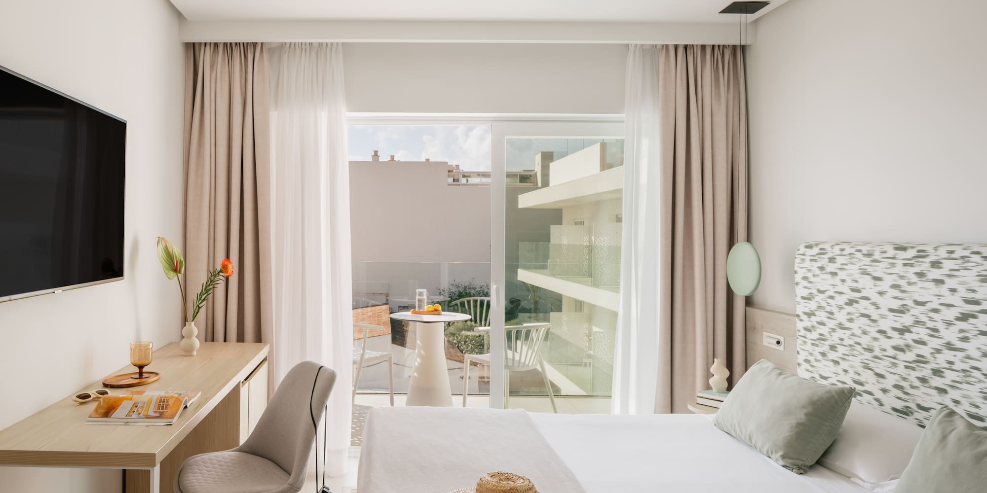 a bedroom with a bed and a desk