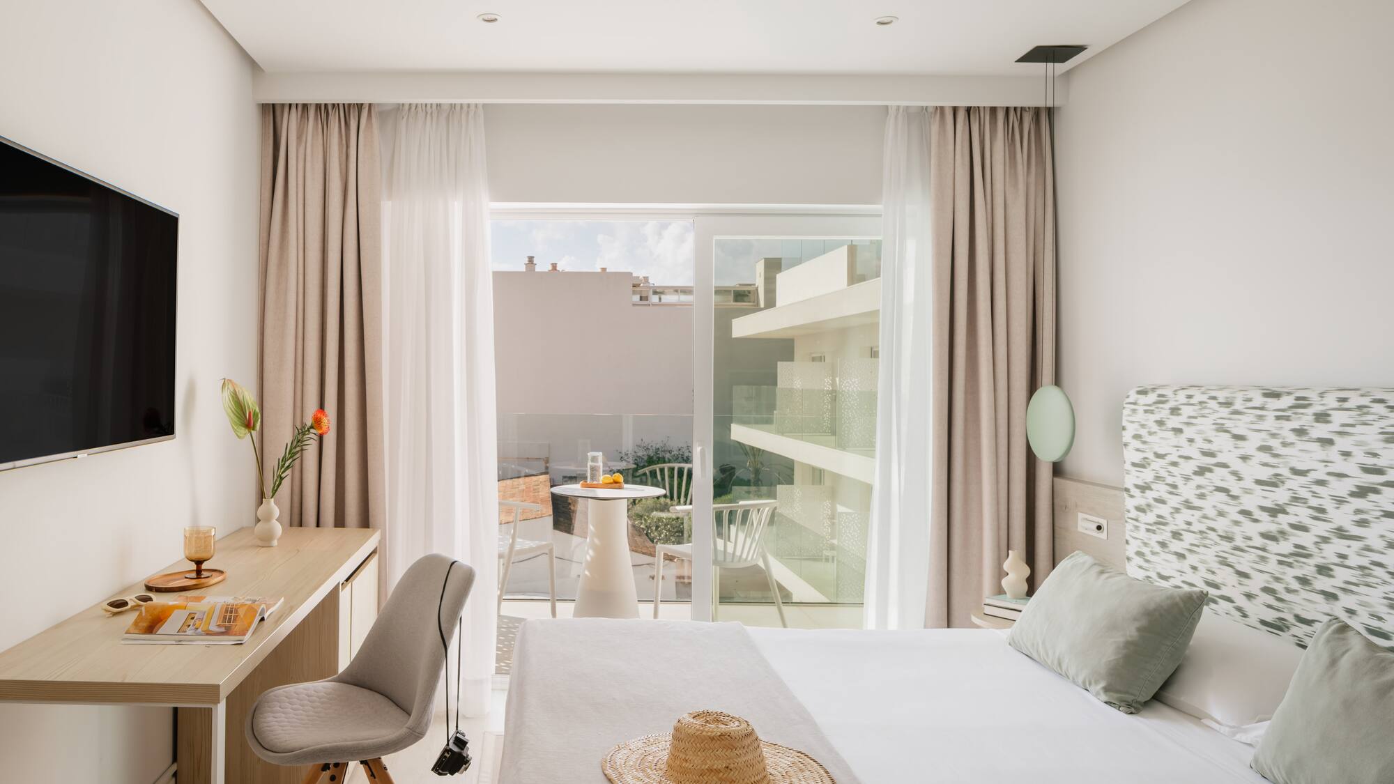 a bedroom with a bed and a desk