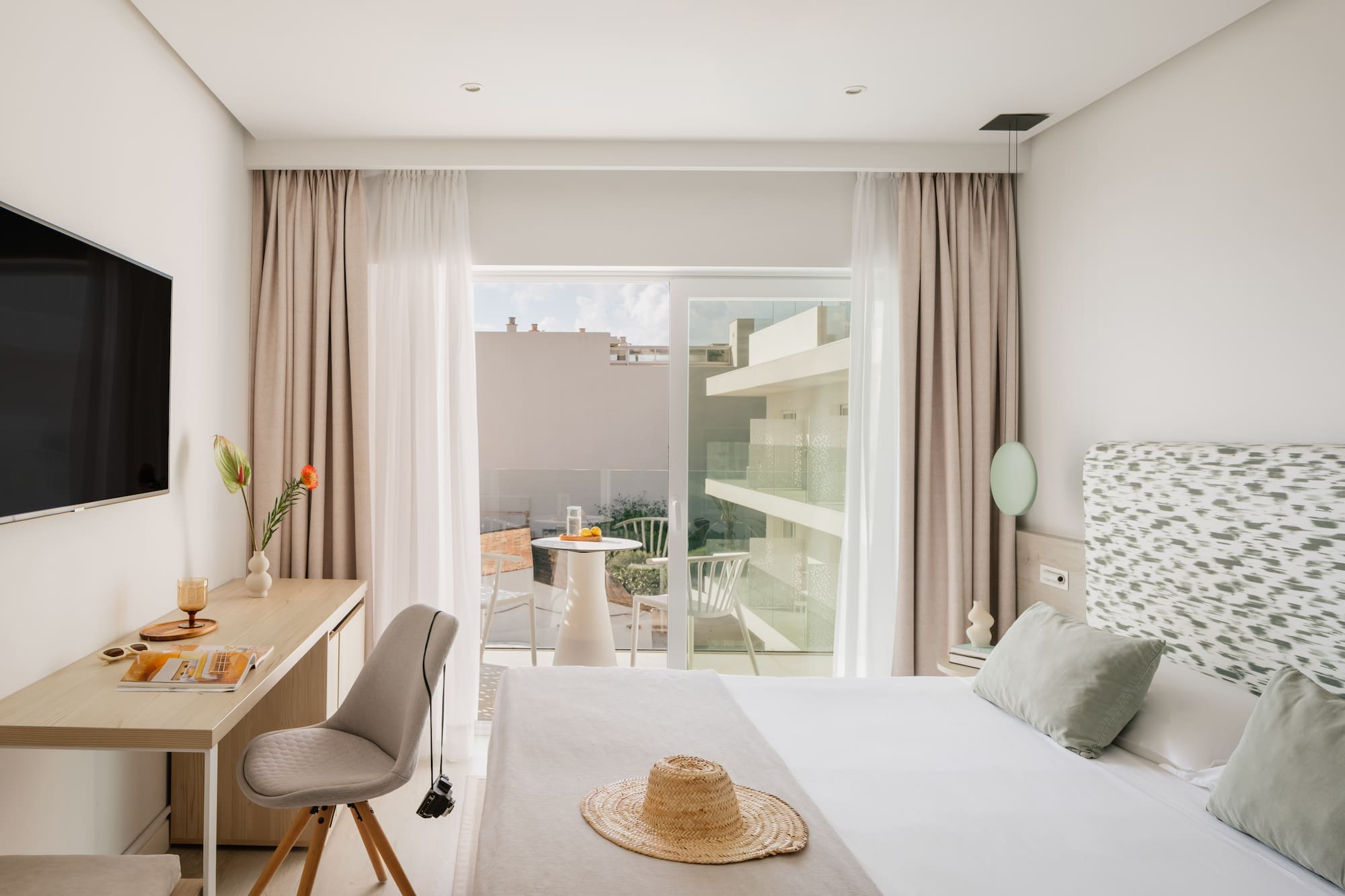 a bedroom with a bed and a desk