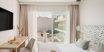 a bedroom with a bed and a desk