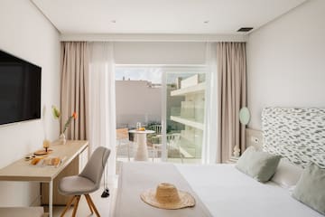 a bedroom with a bed and a desk