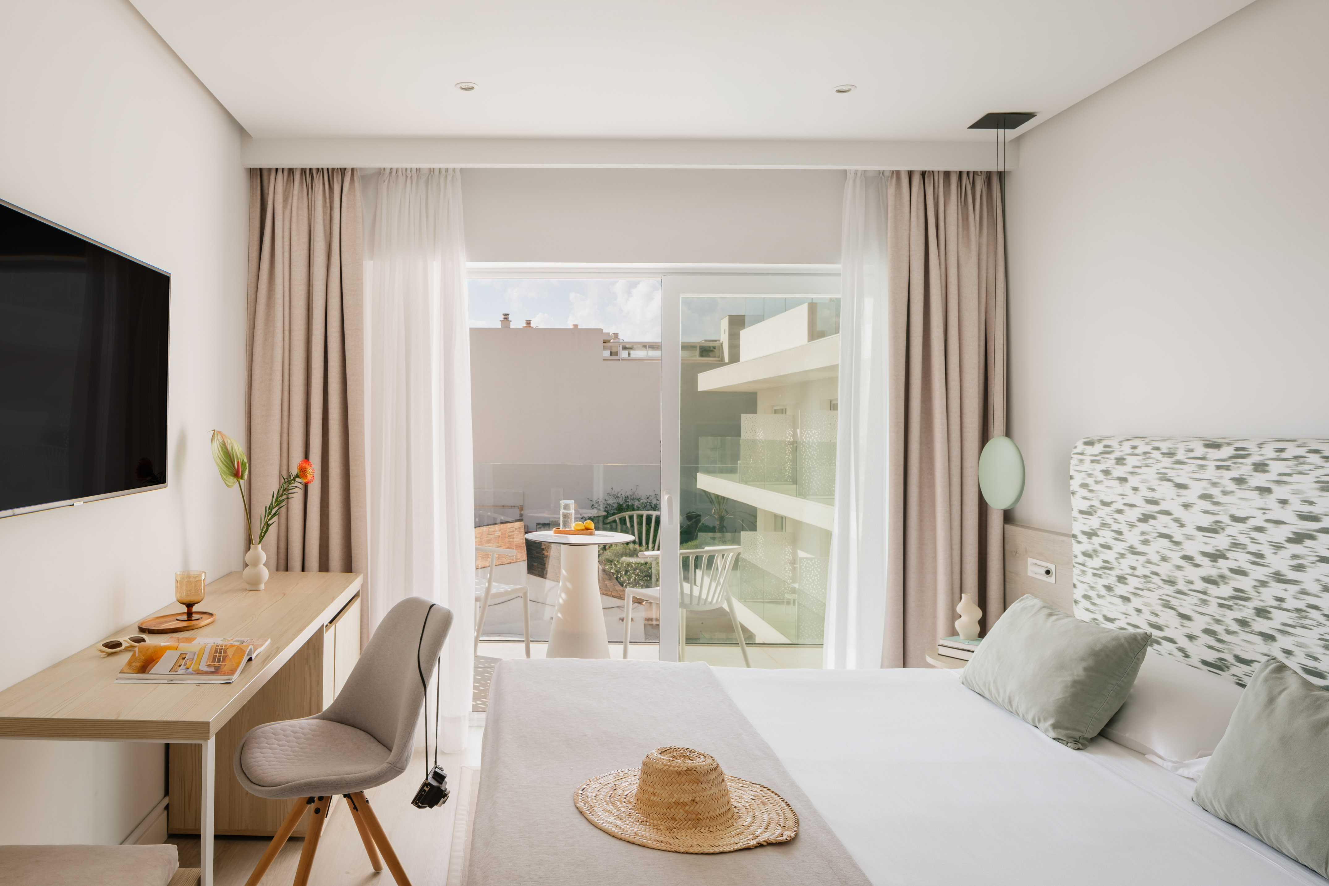 a bedroom with a bed and a desk