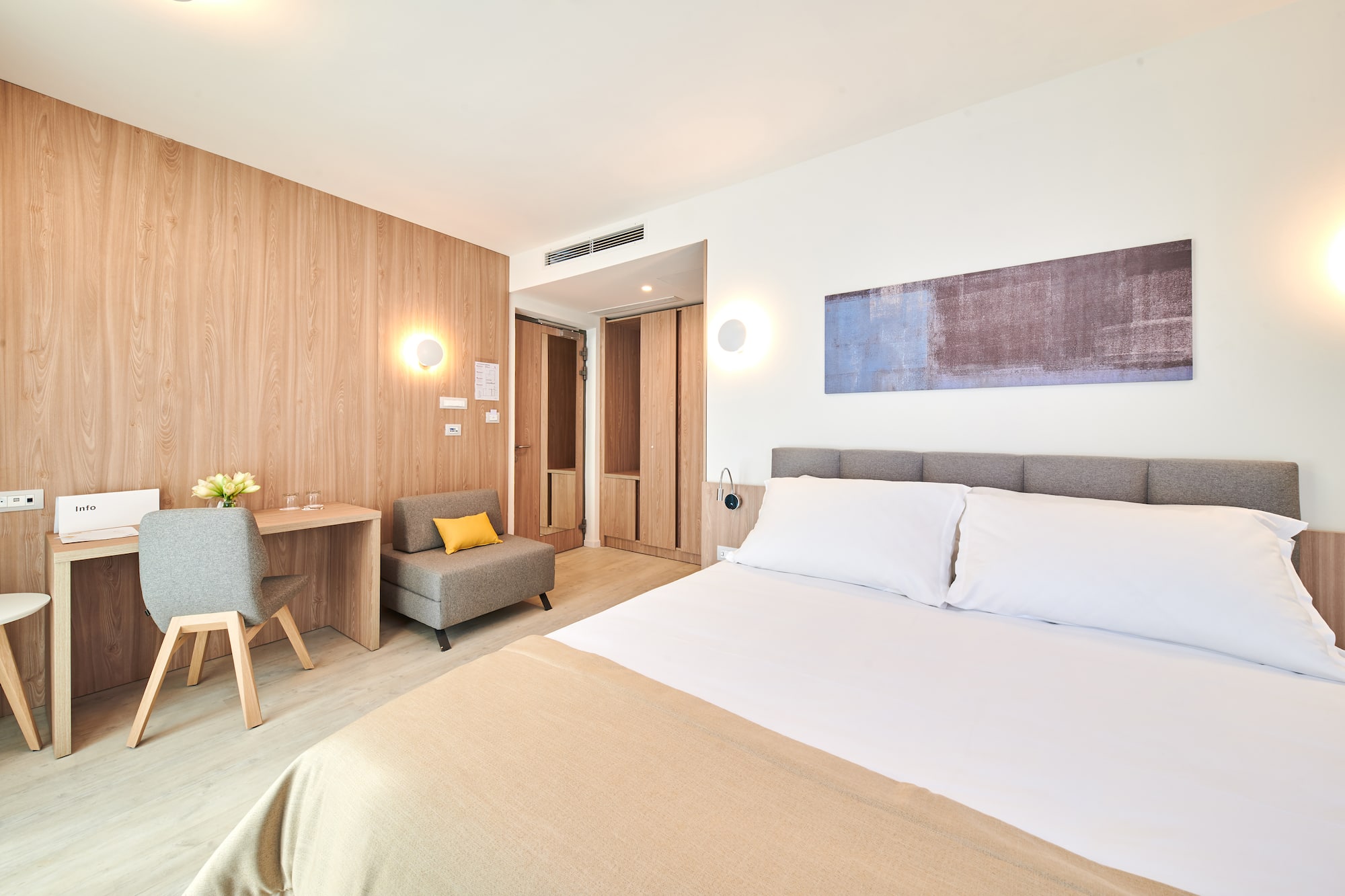 a bedroom with a bed and a chair