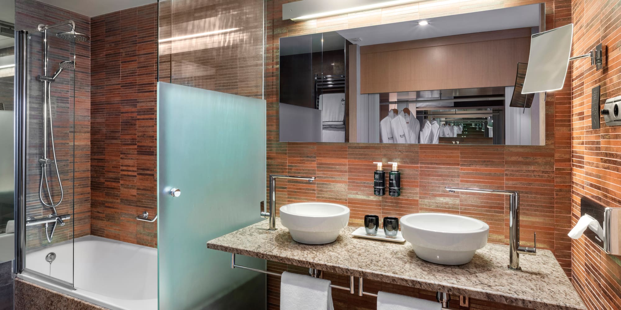 a bathroom with a shower and sink