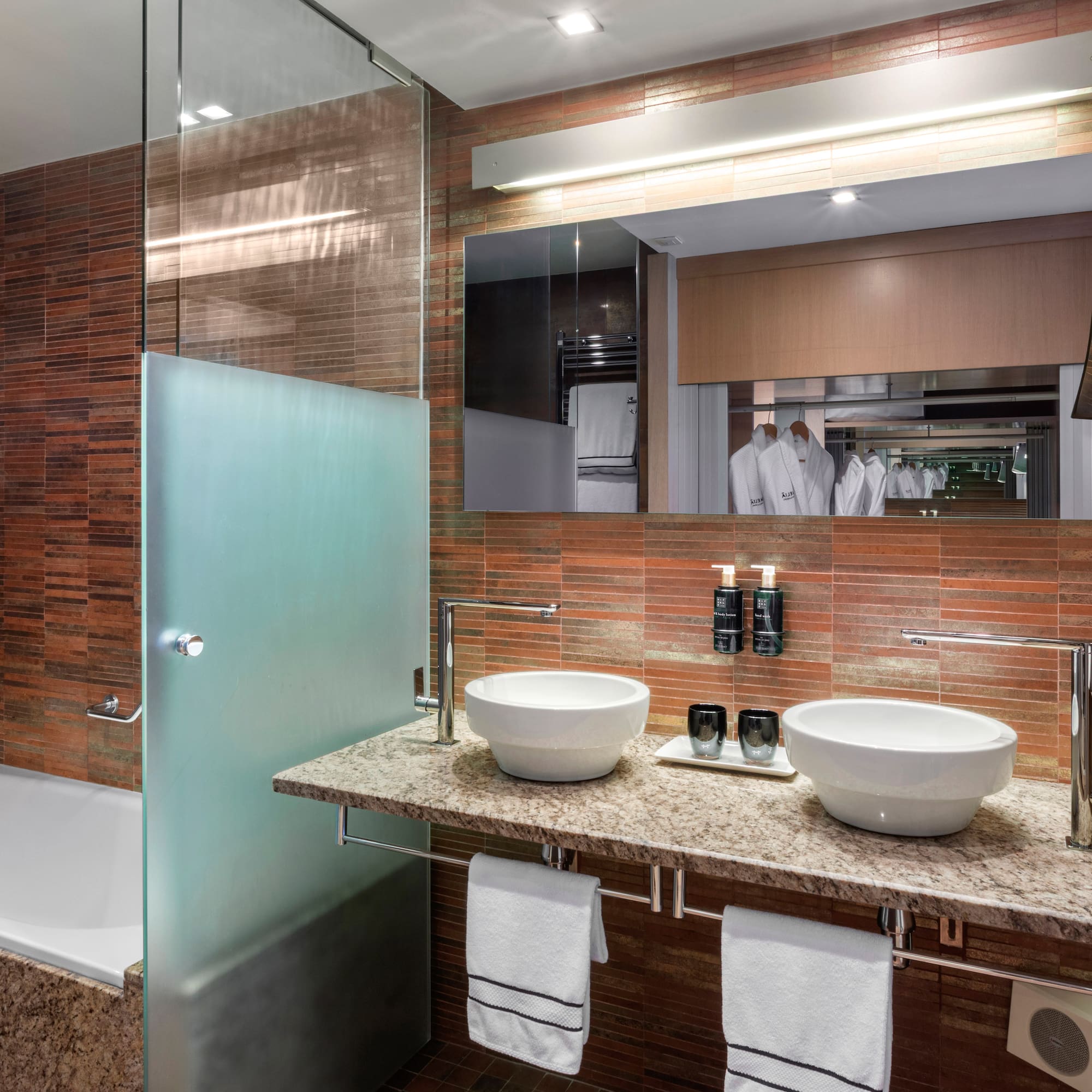 a bathroom with a shower and sink