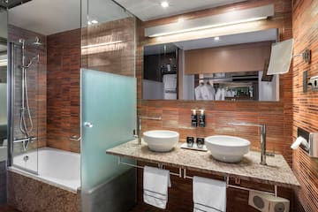 a bathroom with a shower and sink