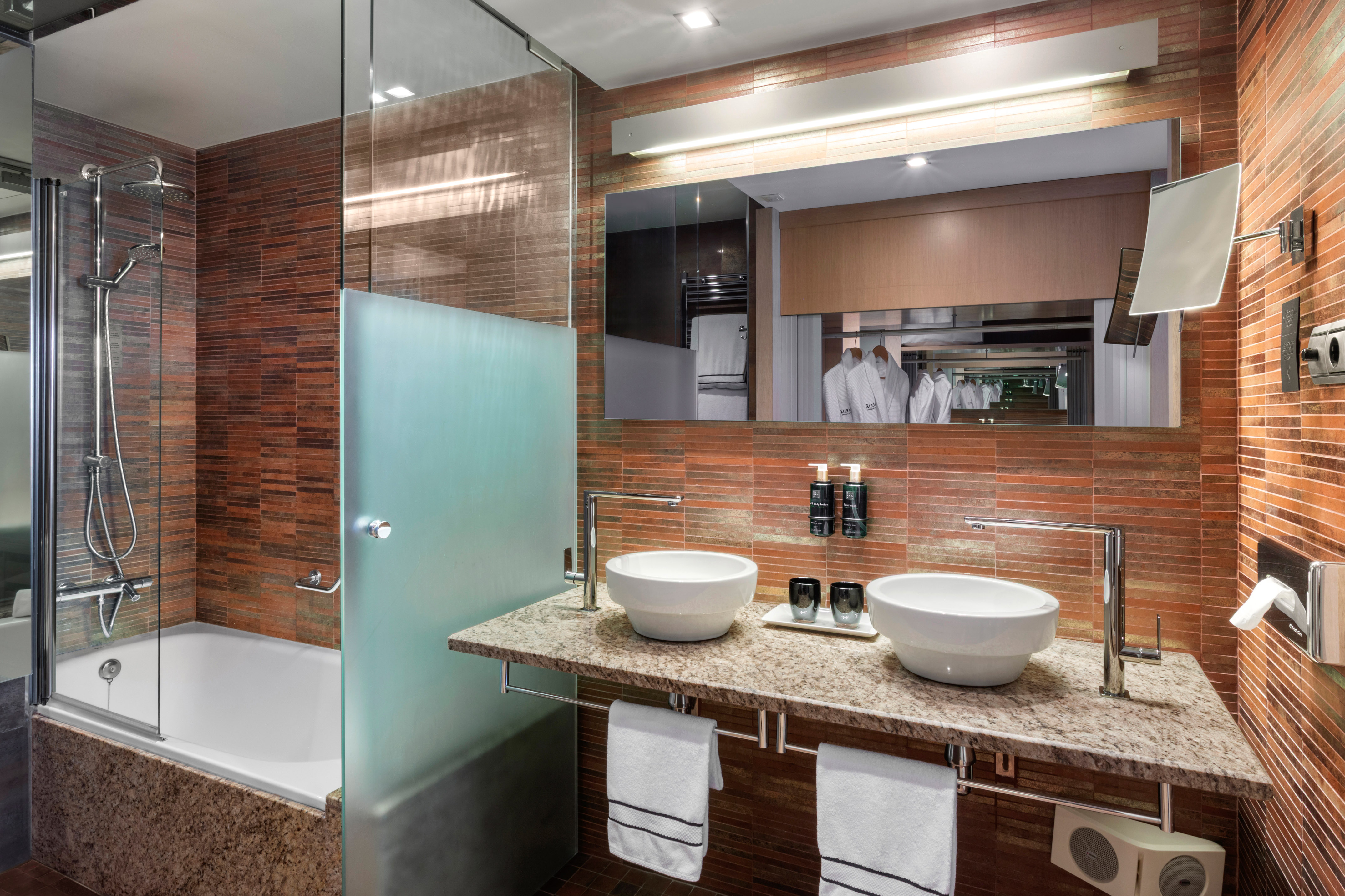 a bathroom with a shower and sink